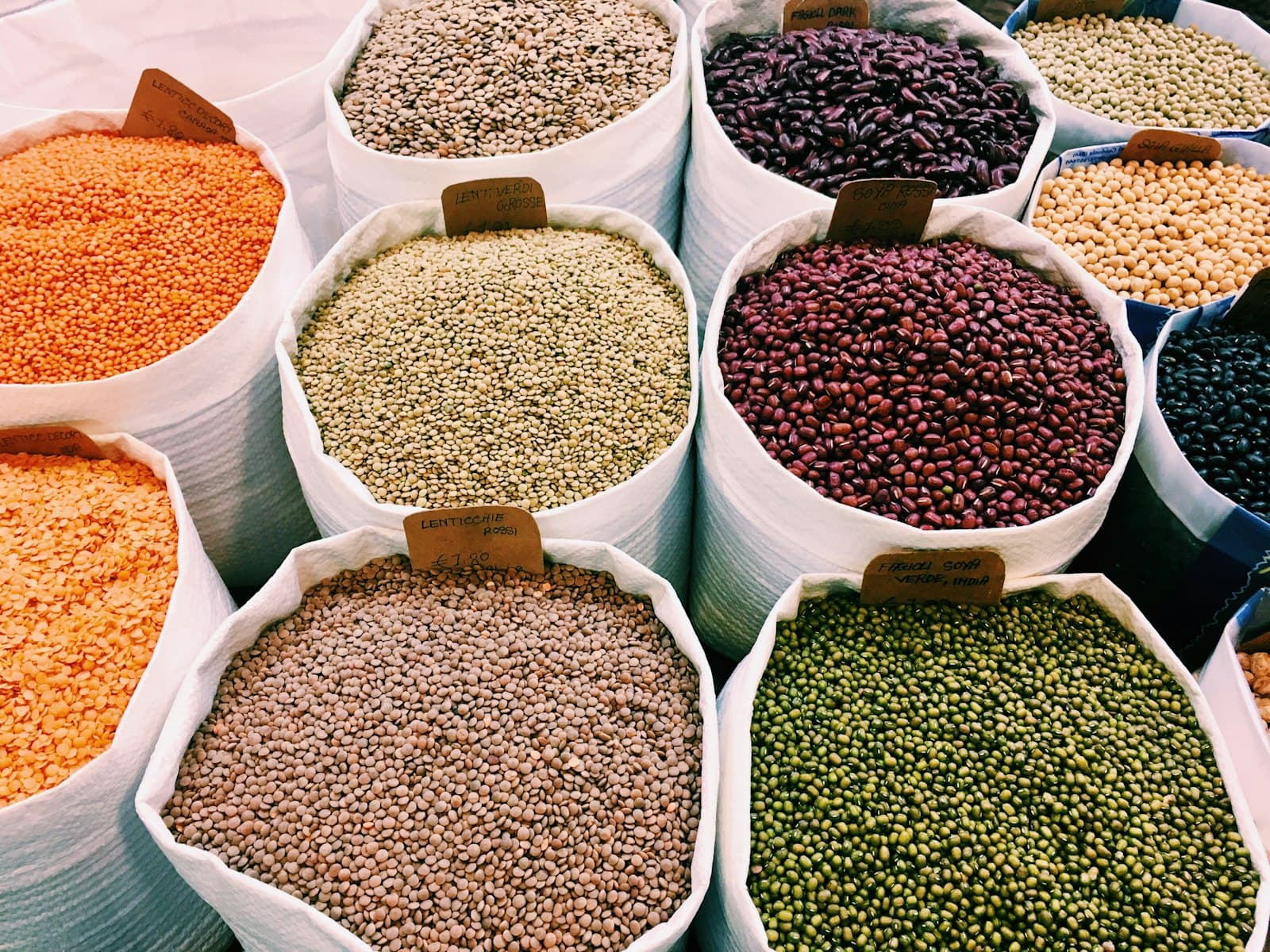 Open sacks of lentils, beans and peas at a market